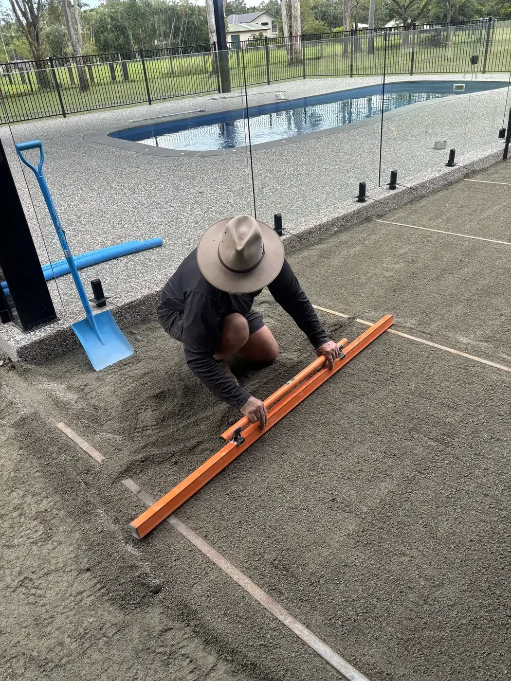 Northern Synergy Group screeding the prepared base for a paved courtyard in Cairns