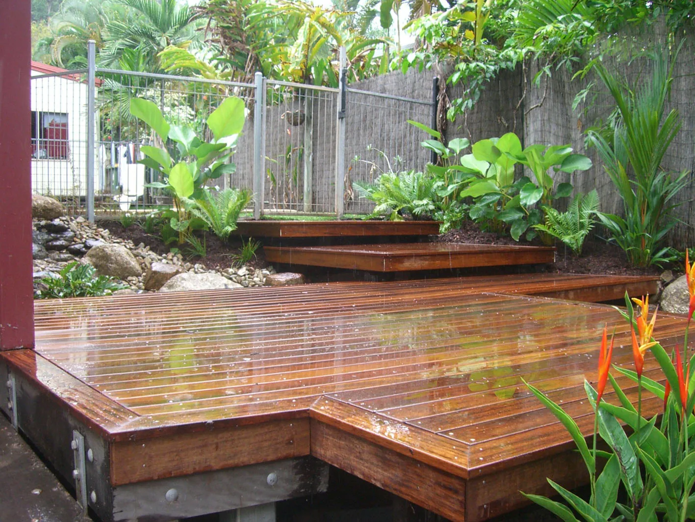Tiered timber deck and creek bed landscaping project at Mission Beach
